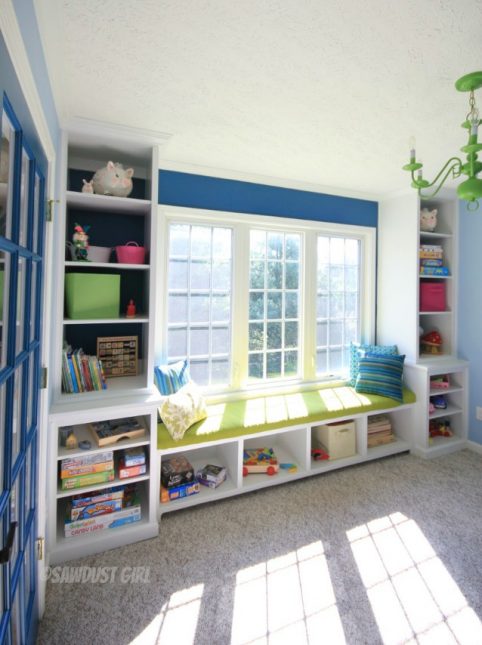 How to Build Built-in Playroom Window Seat and Storage Cabinets - Playroom built-in window seat and storage. https://sawdustdiaries.com