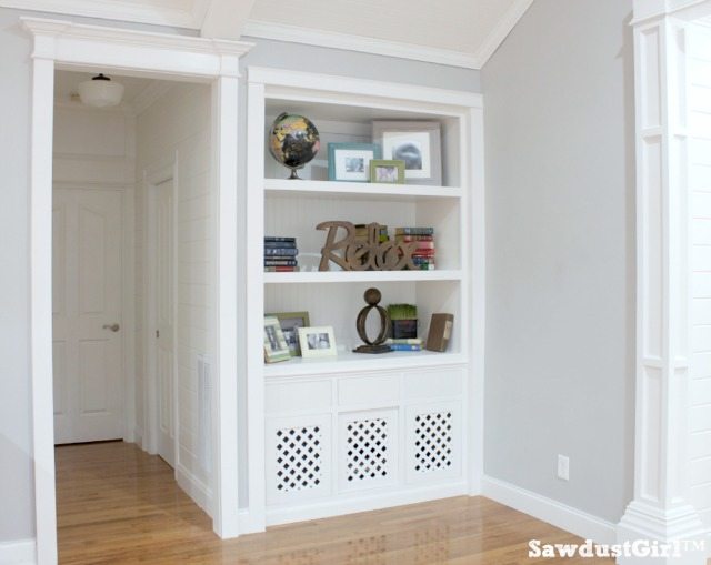 White built-ins, hallway with planked walls and trim moulding.