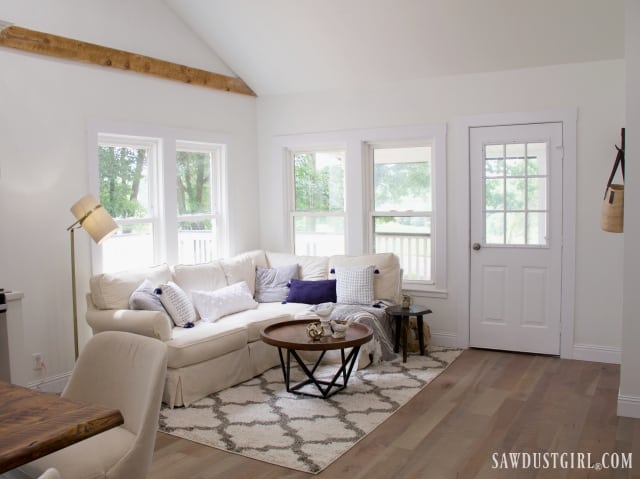 natural living room decor, exposed wood beam