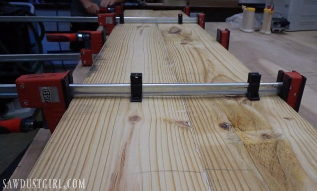 Bessey clamps hold wood firmly together while glue sets.