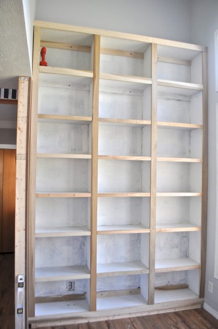 Built in bookcases in library. Wall to wall and super tall