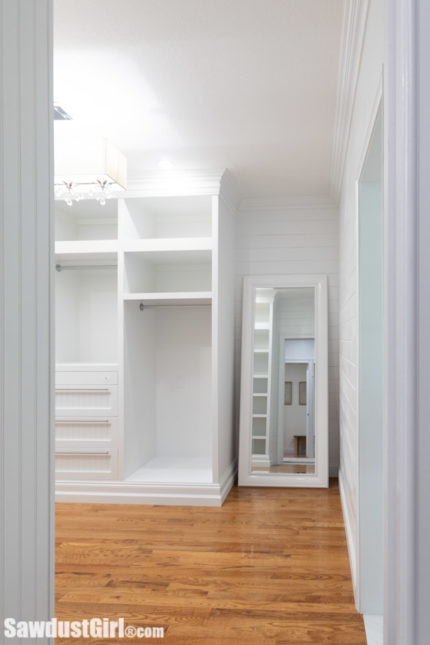 Large walk-in closet with custom cabinetry
