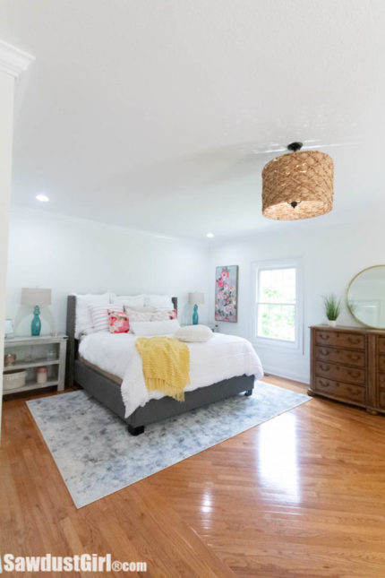 master bedroom with custom wicker light
