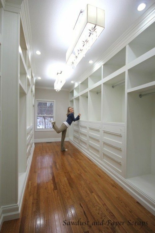 Custom made closets with white built-in cabinets
