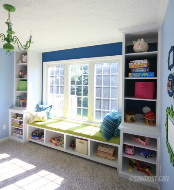 How to Build Built-in Playroom Window Seat and Storage Cabinets - Playroom built-in window seat and bookshelf storage. https://sawdustdiaries.com