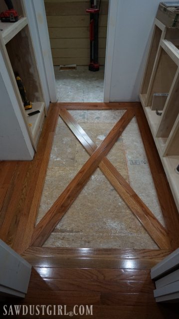 Wood floor with brick tile inlay